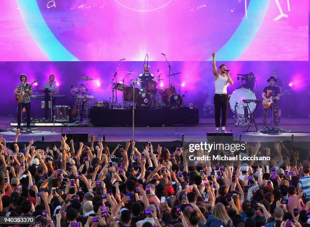 Lead guitarist Wayne Sermon, drummer Daniel Platzman, singer Dan Reynolds and keyboard/bassist Ben McKee of Imagine Dragons perform onstage during...