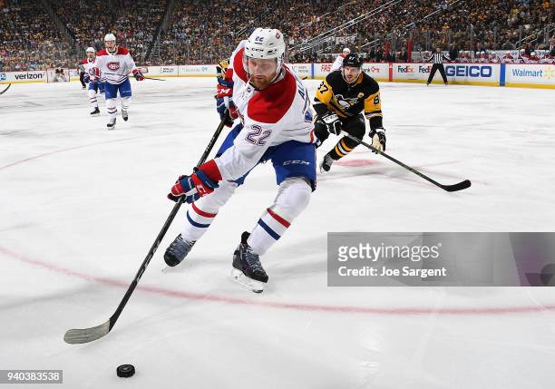 Karl Alzner of the Montreal Canadiens handles the puck against the Pittsburgh Penguins at PPG Paints Arena on March 31, 2018 in Pittsburgh,...