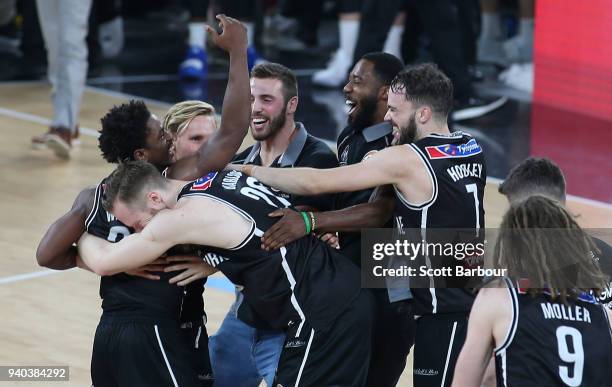 Casper Ware of Melbourne United and his teammates celebrate winning game five of the NBL Grand Final series between Melbourne United and the Adelaide...