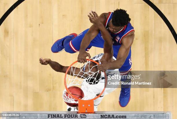 Udoka Azubuike of the Kansas Jayhawks dunks against Dhamir Cosby-Roundtree of the Villanova Wildcats in the first half during the 2018 NCAA Men's...