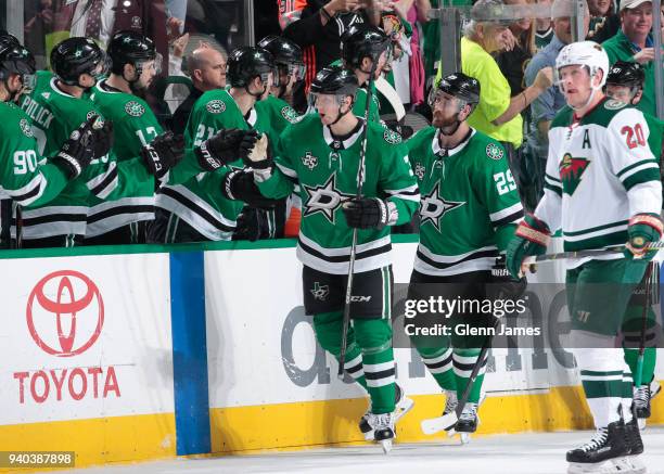 John Klingberg, Greg Pateryn and the Dallas Stars celebrate a goal against the Minnesota Wild at the American Airlines Center on March 31, 2018 in...