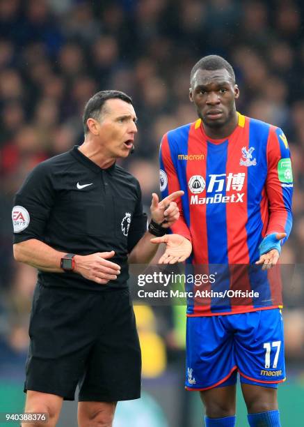 Referee Neil Swarbrick has words with Christian Benteke of Crystal Palace during the Premier League match between Crystal Palace and Liverpool at...