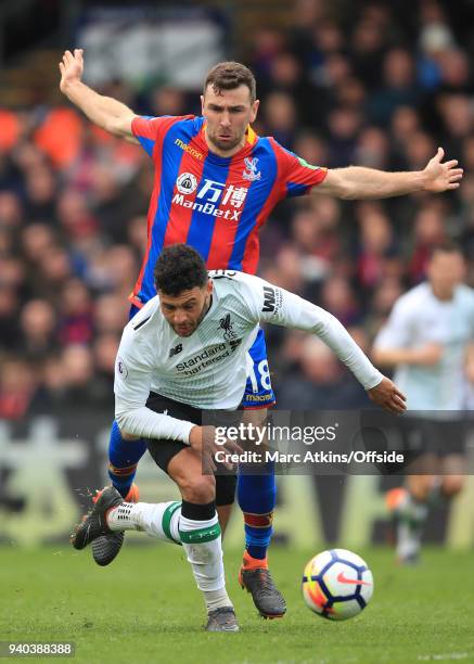 Alex Oxlade-Chamberlain of Liverpool in action with James McArthur of Crystal Palace during the Premier League match between Crystal Palace and...