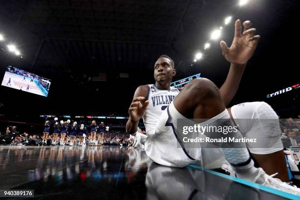 Dhamir Cosby-Roundtree of the Villanova Wildcats looks on from the bench in the first half against the Kansas Jayhawks during the 2018 NCAA Men's...