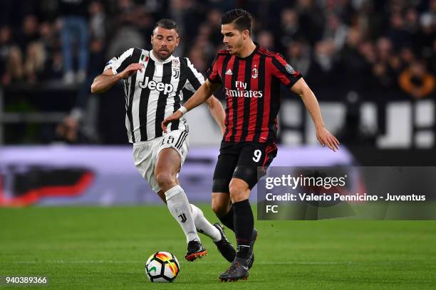 Andrea Barzagli of Juventus competes for the ball with André Silva of AC Milan during the serie A match between Juventus and AC Milan at Allianz...