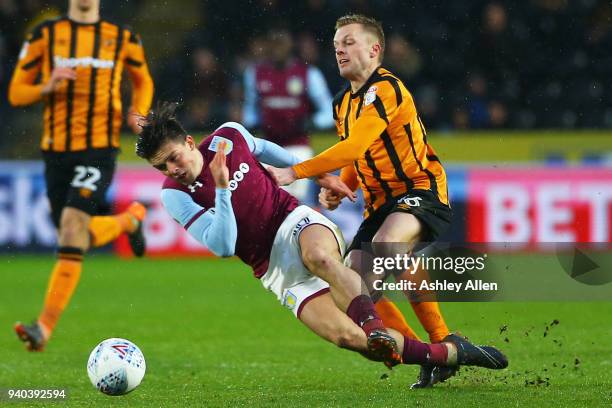 Jack Grealish of Aston Villa is fouled by Sebastian Larsson of Hull City during the Sky Bet Championship match between Hull City and Aston Villa at...