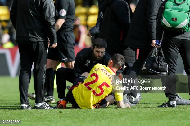 Jose Holebas of Watford receives treatment after his sides 2-2 draw during the Premier League match between Watford and AFC Bournemouth at Vicarage...