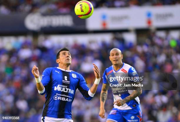Edgar Benitez of Queretaro and Jorge Enriquez of Puebla fight for the ball during the 13th round match between Queretaro and Puebla as part of the...