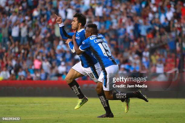 Edson Puch of Queretaro celebrates with teammate Yerson Candelo after scoring his team´s second goal during the 13th round match between Queretaro...
