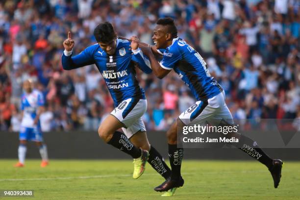 Edson Puch of Queretaro celebrates with teammate Yerson Candelo after scoring his team´s second goal during the 13th round match between Queretaro...