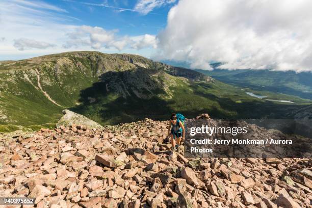 teenage girl hiking at top of cathedral trail on mount katahdin in baxter state park, maine, usa - baxter state park stock pictures, royalty-free photos & images