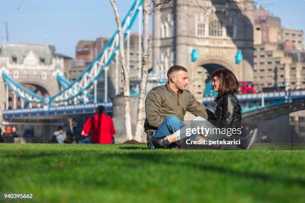 romantic couple relaxing along the thames river - south bank london stock pictures, royalty-free photos & images