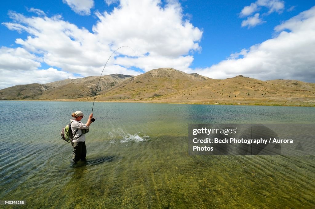 Woman Fly Fishing In Lake New Zealand High-Res Stock Photo - Getty Images