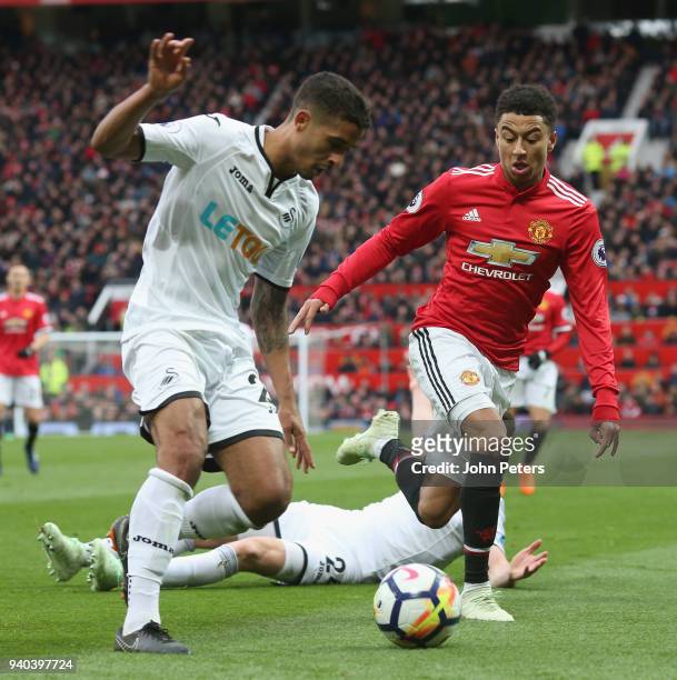 Jesse Lingard of Manchester United in action with Kyle Naughton of Swansea City during the Premier League match between Manchester United and Swansea...