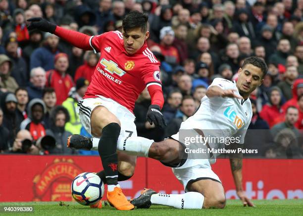 Alexis Sanchez of Manchester United in action with Kyle Naughton of Swansea City during the Premier League match between Manchester United and...