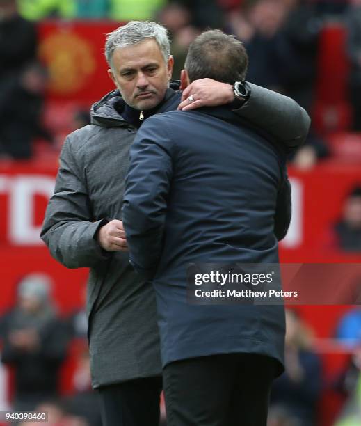 Manager Jose Mourinho of Manchester United commiserates with Manager Carlos Carvalhal of Swansea City during the Premier League match between...
