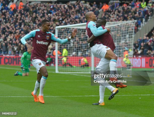 Joao Mario of West Ham United celebrates his goal with Cheikhou Kouyate and Edimilson Fernandes during the Premier League match between West Ham...