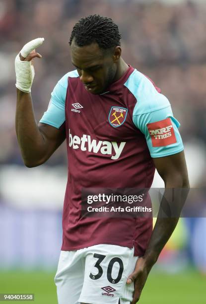 Michail Antonio of West Ham United pulls up injured during the Premier League match between West Ham United and Southampton at London Stadium on...