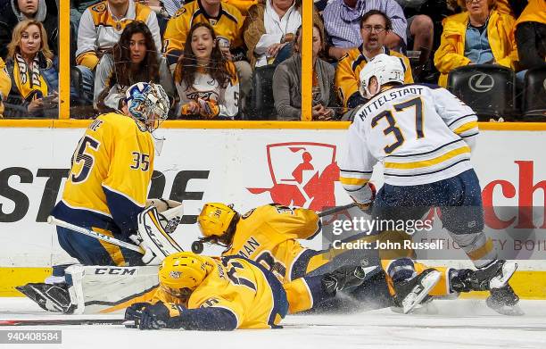 Pekka Rinne of the Nashville Predators makes the save against Casey Mittelstadt of the Buffalo Sabres as Ryan Hartman and P.K. Subban defend during...