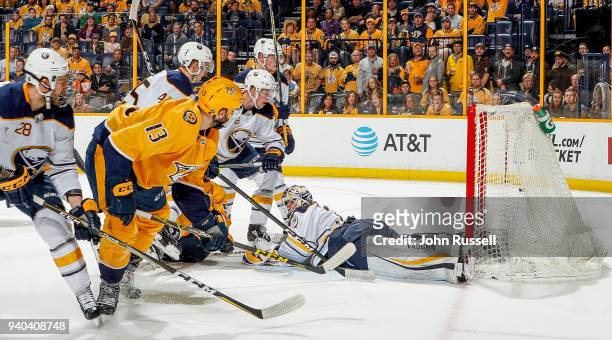 Nick Bonino of the Nashville Predators backhands a shot in the net for a goal against Chad Johnson of the Buffalo Sabres during an NHL game at...