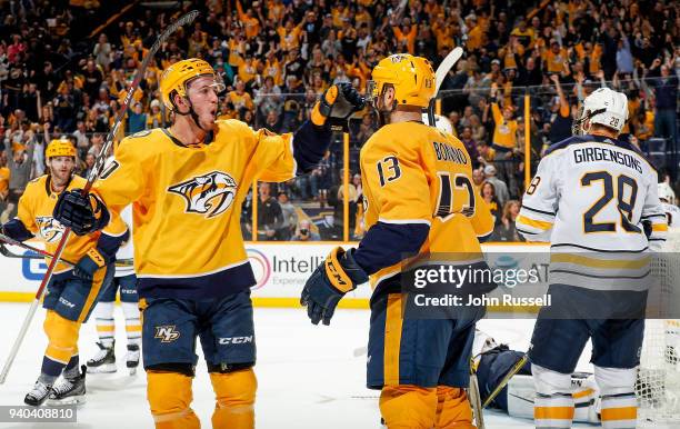 Nick Bonino celebrates his goal with Colton Sissons of the Nashville Predators against the Buffalo Sabres during an NHL game at Bridgestone Arena on...