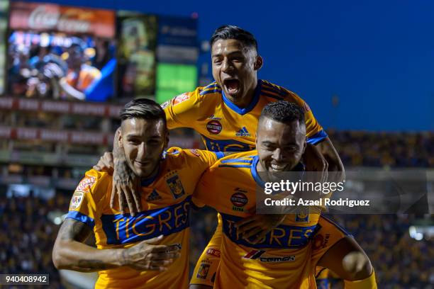 Rafael Carioca of Tigres celebrates with teammates after scoring his team's second goal during the 13th round match between Tigres UANL and Leon as...