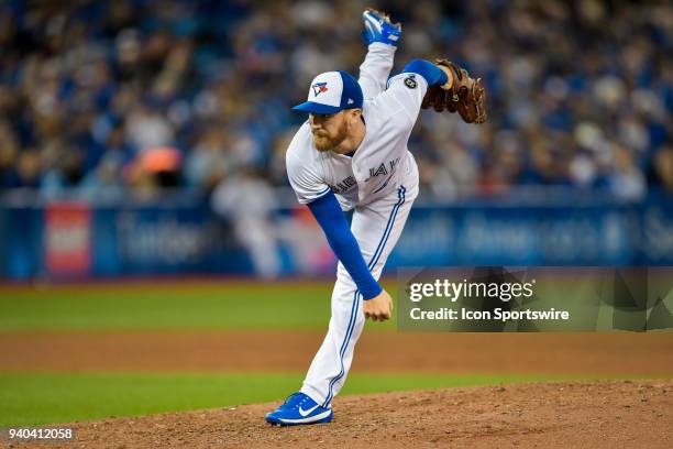 Toronto Blue Jays Pitcher Danny Barnes pitches during the MLB season-opener game between the New York Yankees and the Toronto Blue Jays at Rogers...