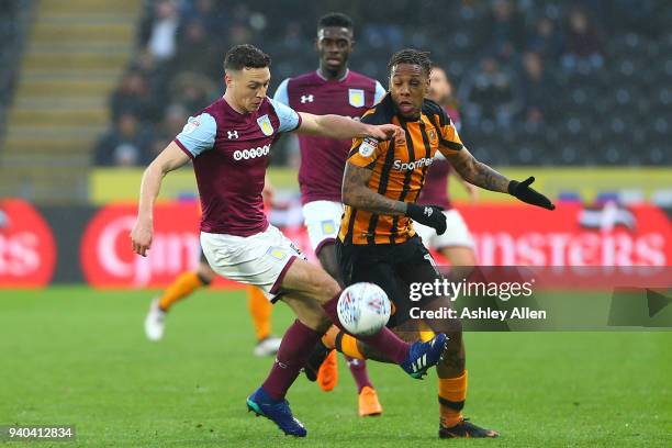 James Chester of Aston Villa keeps the ball from Abel HernÃ¡ndez of Hull City during the Sky Bet Championship match between Hull City and Aston Villa...