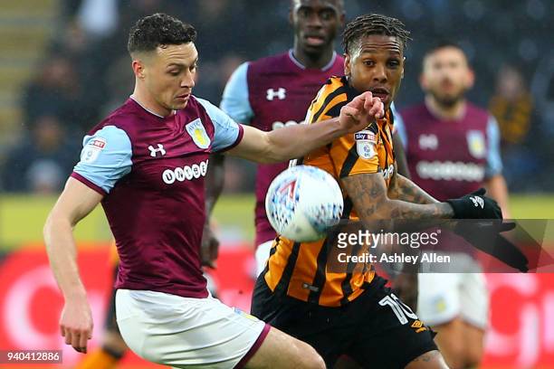 James Chester of Aston Villa and Abel HernÃ¡ndez battle for control of the ball during the Sky Bet Championship match between Hull City and Aston...