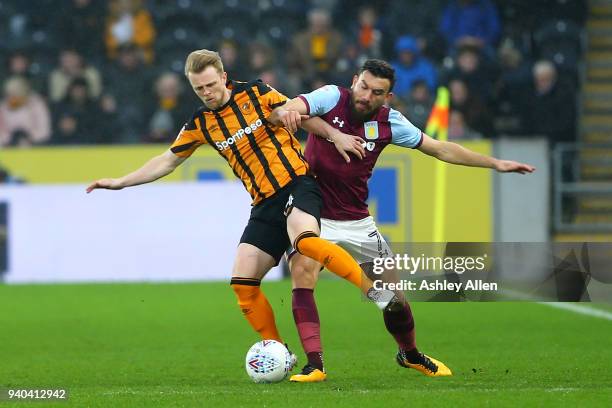 Max Clark of Hull City wins the ball from Robert Snodgrass of Aston Villa during the Sky Bet Championship match between Hull City and Aston Villa at...