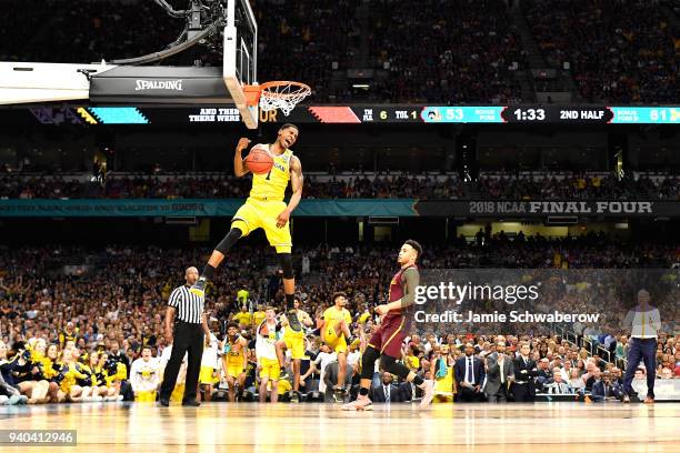 Charles Matthews of the Michigan Wolverines dunks against the Loyola Ramblers during the second half in the 2018 NCAA Photos via Getty Images Men's...