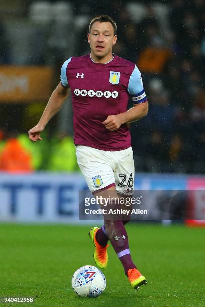 John Terry of Aston Villa runs with the ball during the Sky Bet Championship match between Hull City and Aston Villa at KCOM Stadium on March 31,...