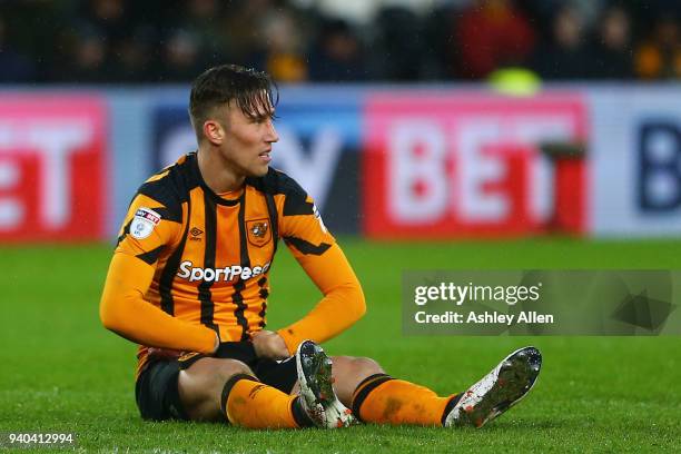 Angus MacDonald of Hull City is injured during the Sky Bet Championship match between Hull City and Aston Villa at KCOM Stadium on March 31, 2018 in...