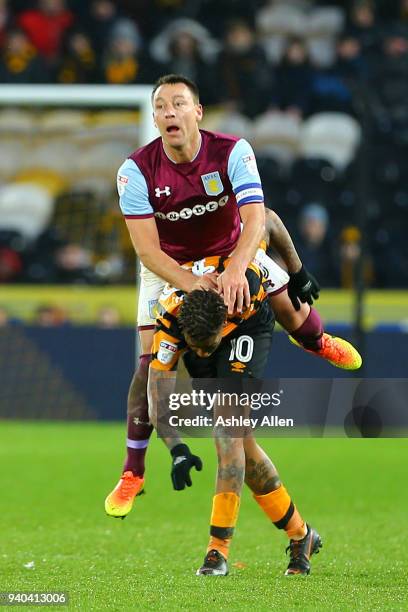 John Terry of Aston Villa clashes with Abel HernÃ¡ndez of Hull City during the Sky Bet Championship match between Hull City and Aston Villa at KCOM...