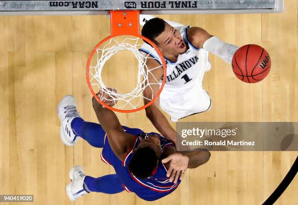 Jalen Brunson of the Villanova Wildcats drives to the basket against Silvio De Sousa of the Kansas Jayhawks during the 2018 NCAA Men's Final Four...