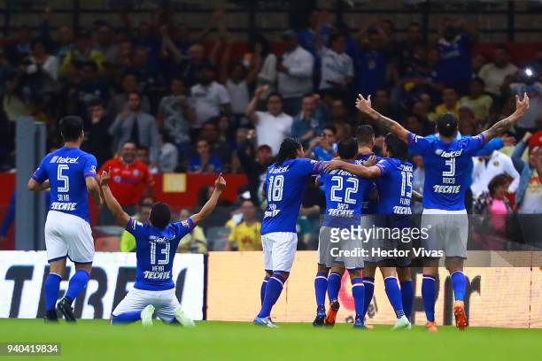 Edgar Mendez of Cruz Azul celebrates with teammates after scoring the first goal of his team during the 13th round match between America and Cruz...