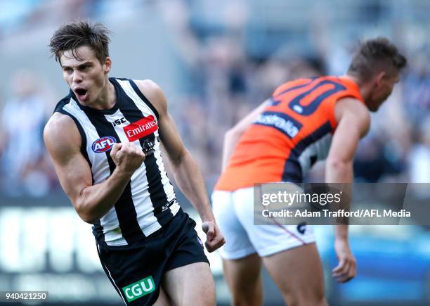 Josh Thomas of the Magpies celebrates a goal during the 2018 AFL round 02 match between the Collingwood Magpies and the GWS Giants at the Melbourne...
