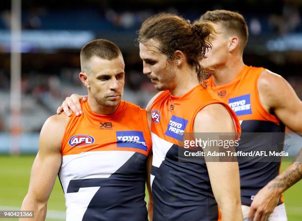 Brett Deledio and Phil Davis of the Giants celebrate during the 2018 AFL round 02 match between the Collingwood Magpies and the GWS Giants at the...