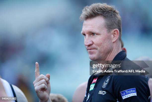 Nathan Buckley, Senior Coach of the Magpies addresses his players during the 2018 AFL round 02 match between the Collingwood Magpies and the GWS...