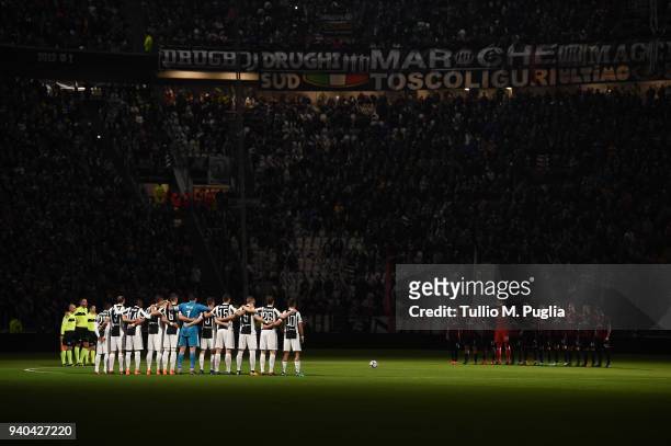 Players of Juventus and Milan observe a minute of silence in memory of Emiliano Mondonico during the serie A match between Juventus and AC Milan at...