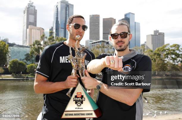 Melbourne United captain Chris Goulding and Josh Boone pose with the trophy after winning the NBL Grand Championship during a Melbourne United media...