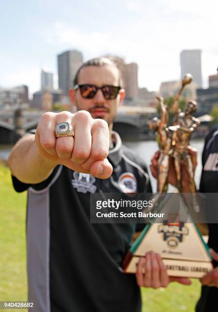 Melbourne United captain Chris Goulding poses with the trophy and his championship ring after winning the NBL Grand Championship during a Melbourne...
