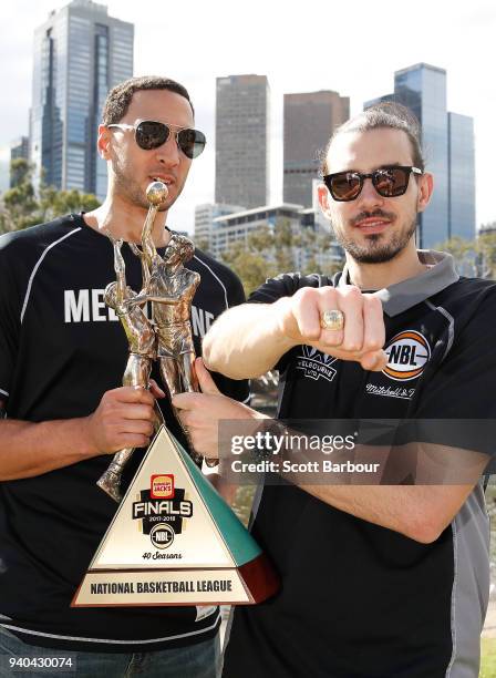 Melbourne United captain Chris Goulding and Josh Boone pose with the trophy and their championship rings after winning the NBL Grand Championship...