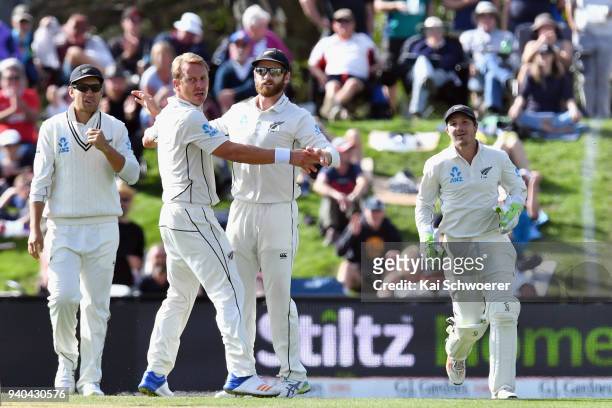 Neil Wagner and Kane Williamson of New Zealand reacting during day three of the Second Test match between New Zealand and England at Hagley Oval on...