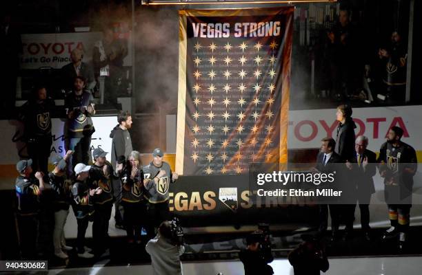 Family members of October 1 shooting victim Neysa Tonks line up at left and Vegas Golden Knights general manager George McPhee, Chairman, CEO and...