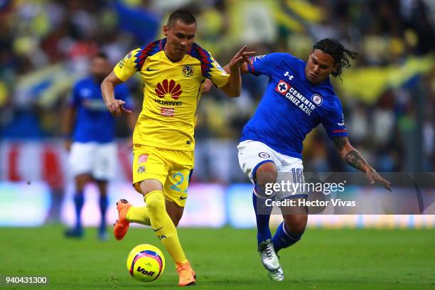 Paul Aguilar of America struggles for the ball with Carlos Pena of Cruz Azul during the 13th round match between America and Cruz Azul as part of the...