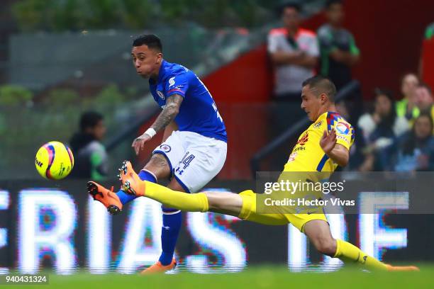 Martin Rodriguez of Cruz Azul struggles for the ball with Paul Aguilar of America during the 13th round match between America and Cruz Azul as part...