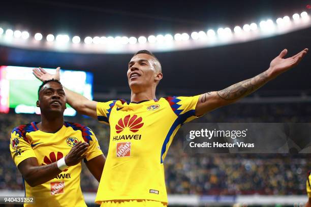 Matheus Uribe of America celebrates with teammates after scoring the first goal of his team during the 13th round match between America and Cruz Azul...