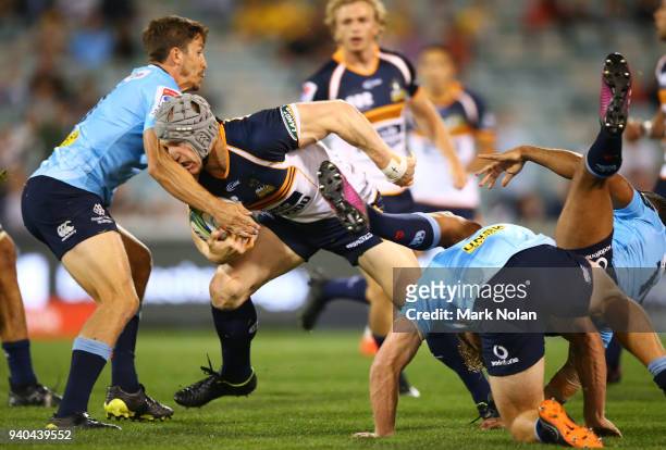 David Pocock of the Brumbies runs the ball during the round seven Super Rugby match between the Brumbies and the Waratahs at GIO Stadium on March 31,...