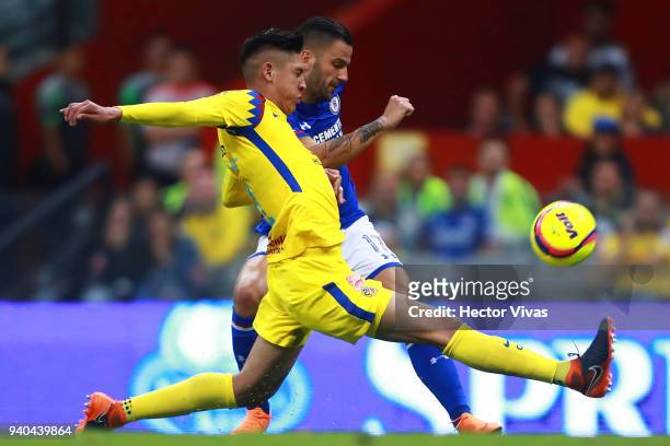 Edgar Mendez of Cruz Azul struggles for the ball with Edson Alvarez of America during the 13th round match between America and Cruz Azul as part of...